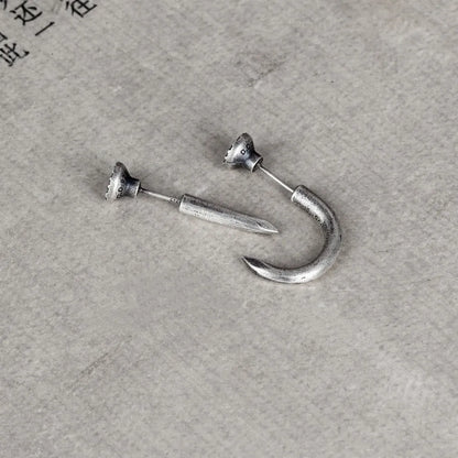 Sterling silver nail stud earrings showing straight and curved punk retro styles
