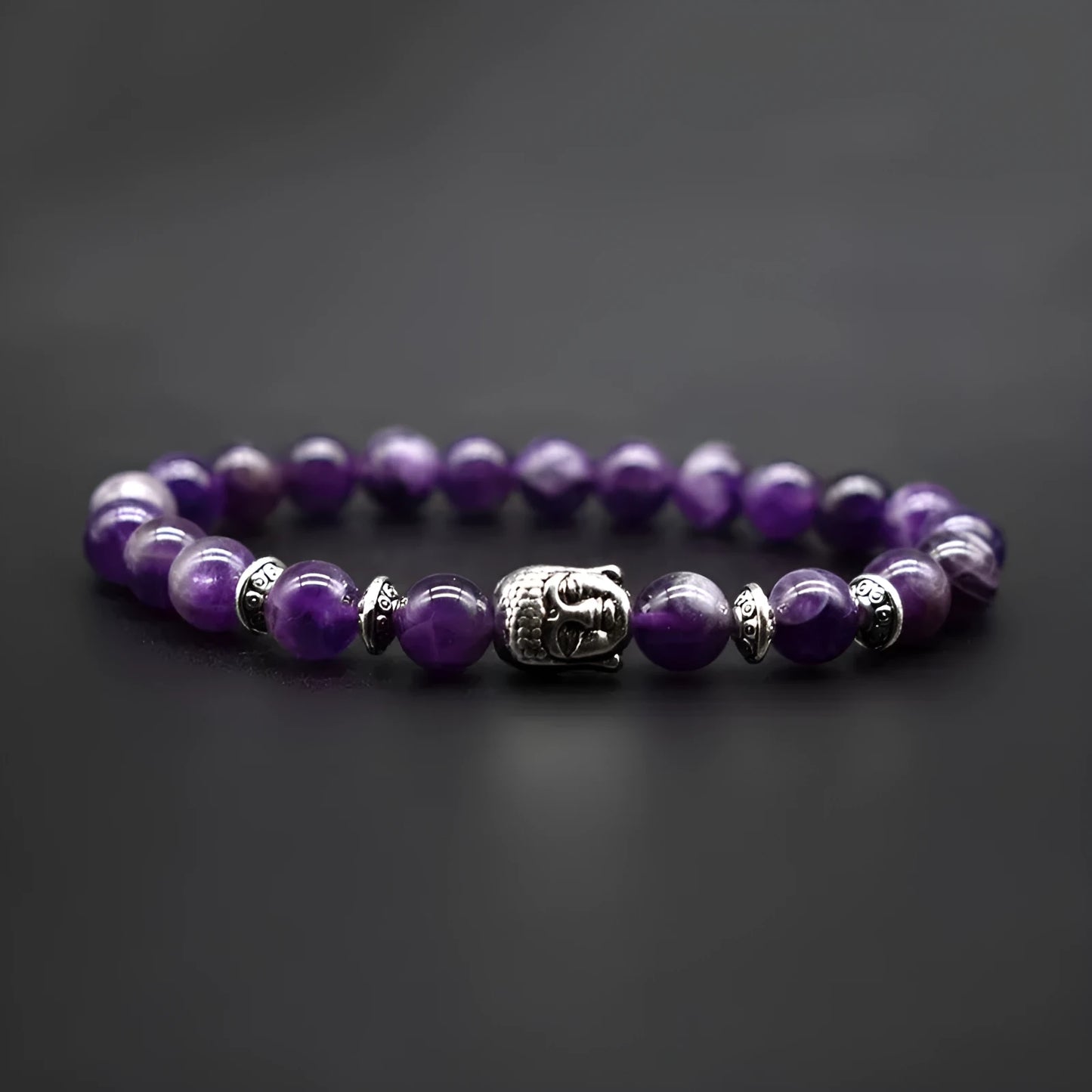 Unisex amethyst bracelet with a detailed Buddha head charm in one of five gemstone colours.