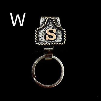 Handmade cow tag design metal keychain on a keyring, shown in one of many available colours.