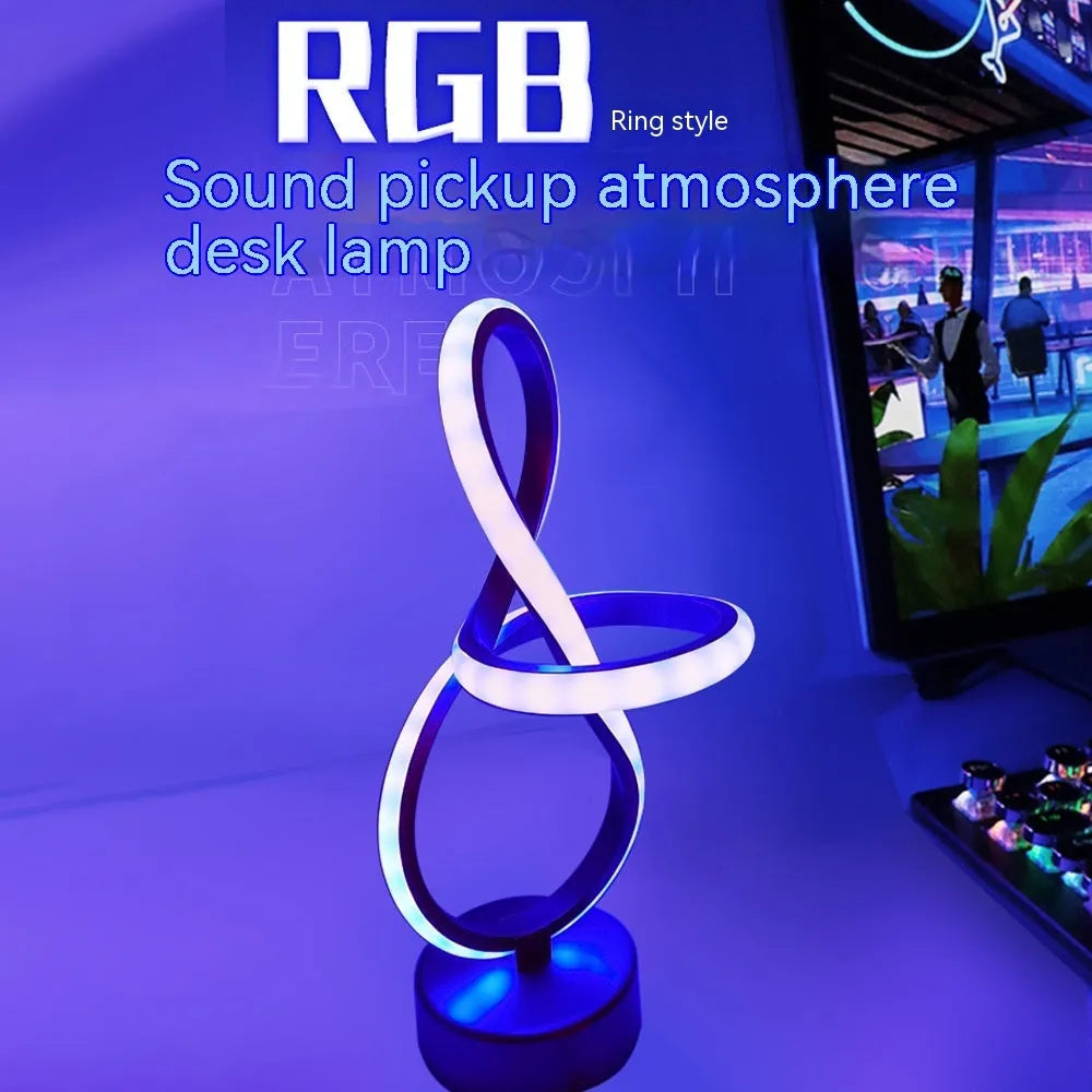 Black remote-controlled LED night light with Bluetooth remote on a bedside table.