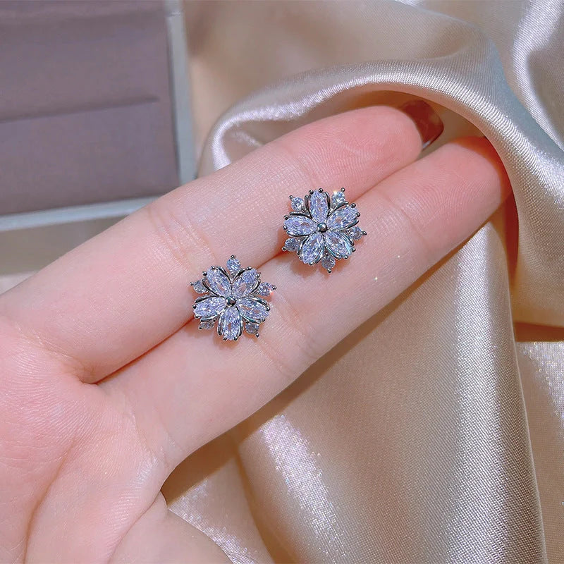 Dazzling cubic zirconia jewellery set with double-layered flower design, including ring, necklace, and earrings in pink and white diamond colours