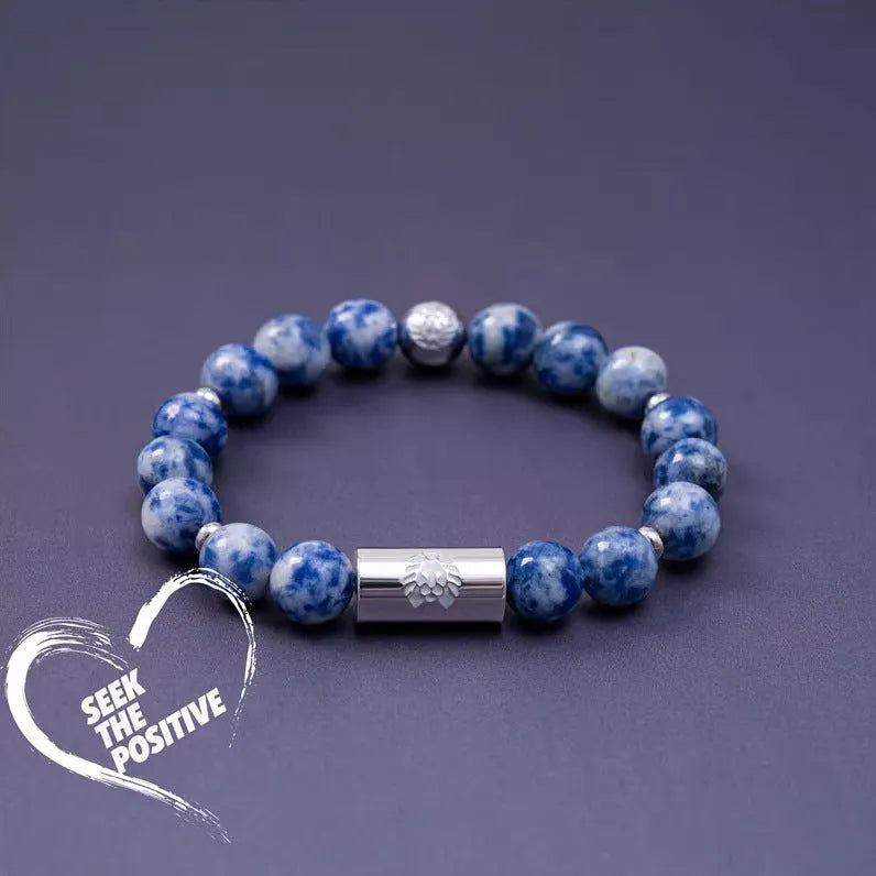 Little Lion ethnic geometric bracelet made from brown Bodhi seed beads on a wrist.