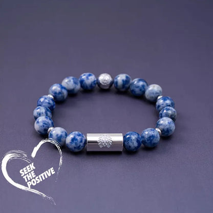 Little Lion ethnic geometric bracelet made from brown Bodhi seed beads on a wrist.
