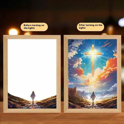 Modern rectangular light painting photo frame displaying an illuminated cross and scenic artwork.
