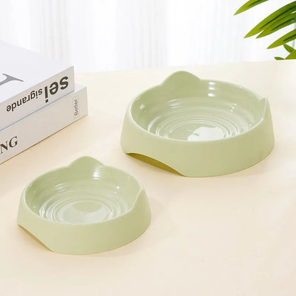 Blue ceramic dog slow feeder bowl with raised internal maze pattern for large breed dogs on a wooden floor.