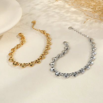 Women's hollow heart bracelet in stainless steel with 18K gold plating showing geometric design