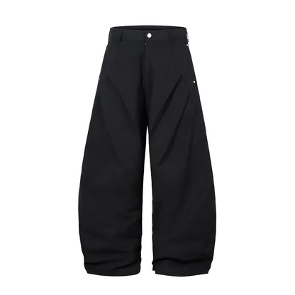 Men's black cotton pleated casual trousers with a loose-fitting wide-leg silhouette.