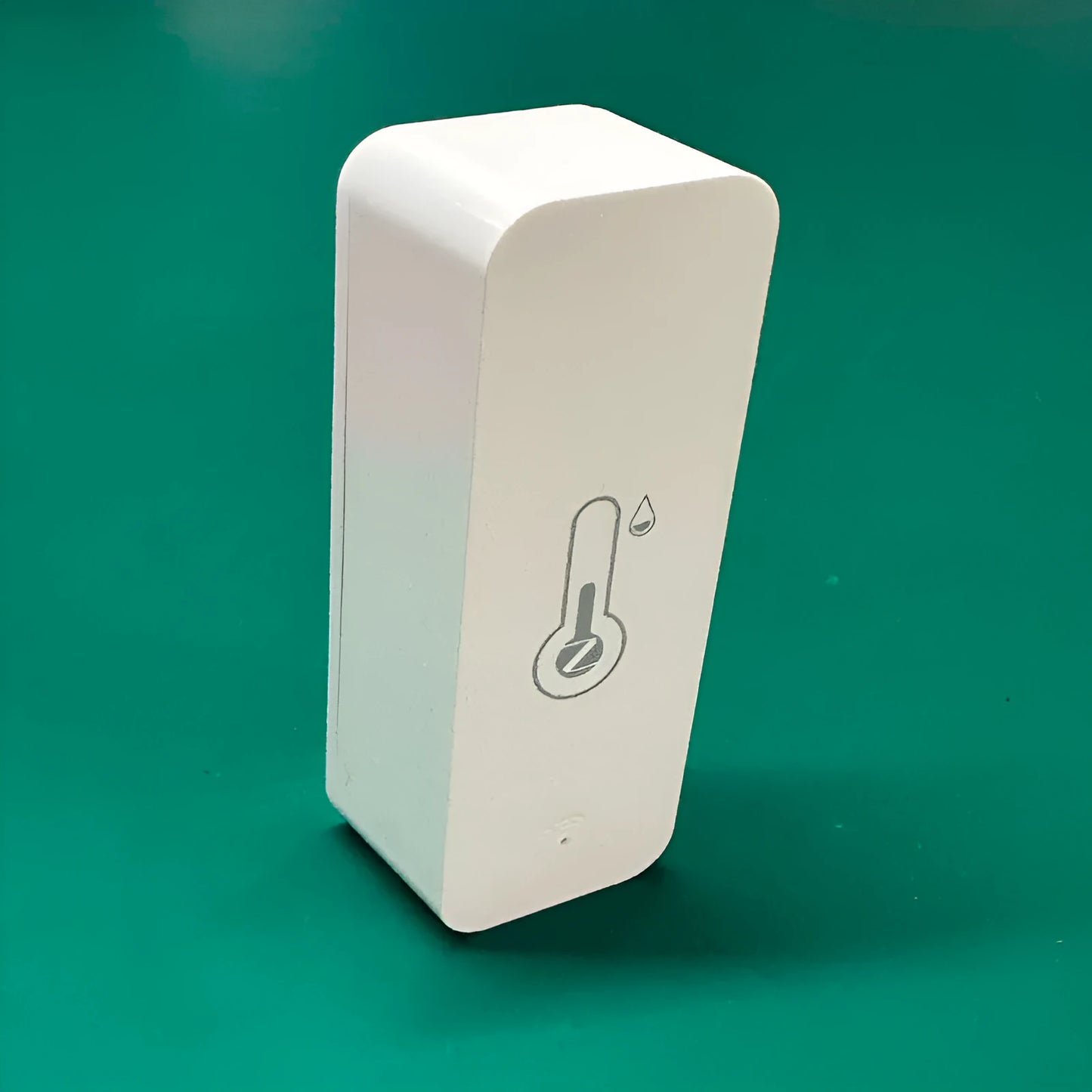 Compact white ABS plastic WiFi and Zigbee temperature and humidity sensor for smart homes.