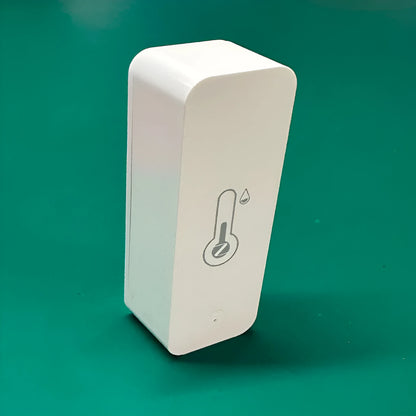Compact white ABS plastic WiFi and Zigbee temperature and humidity sensor for smart homes.