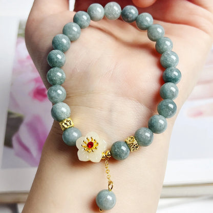 Women's adjustable jade bracelet with rope fastening showing retro styling and optimised jade colour