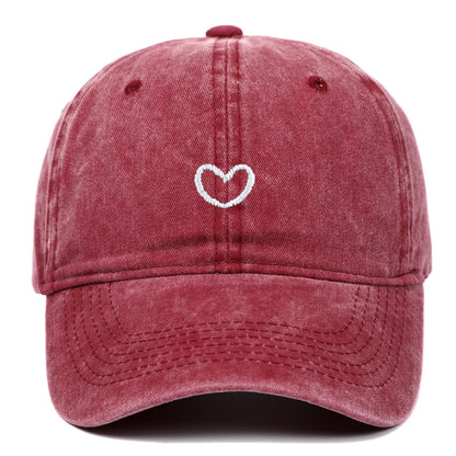 Retro-style baseball cap with colourful machine embroidery on a soft cotton dome crown, shown in a wine red colour.