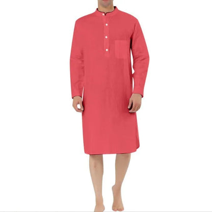 Man wearing a dark blue cotton shirt robe with button front, long sleeves, and side pockets.
