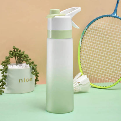 White spray water bottle with black leakproof lid and handle strap on a table