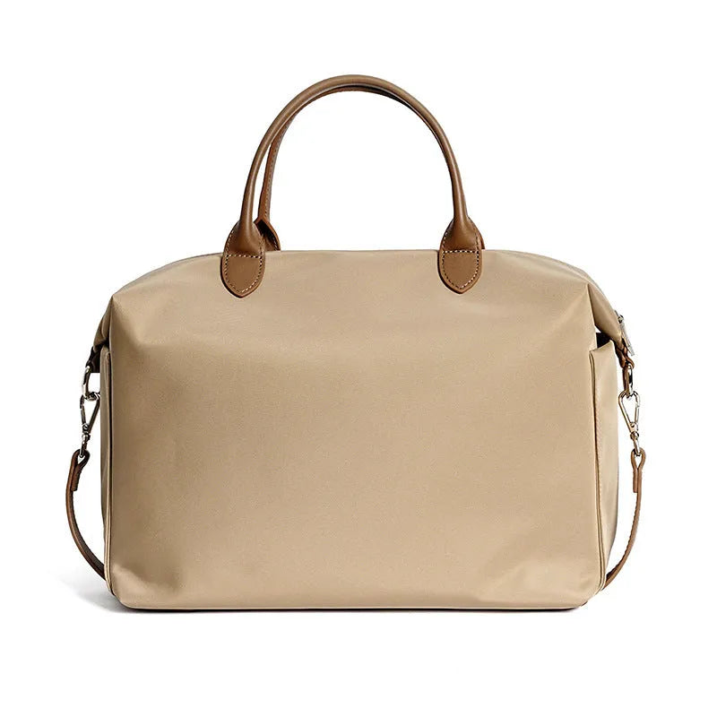 Waterproof nylon shoulder bag with leather accents in black or light khaki, showing 35cm width.