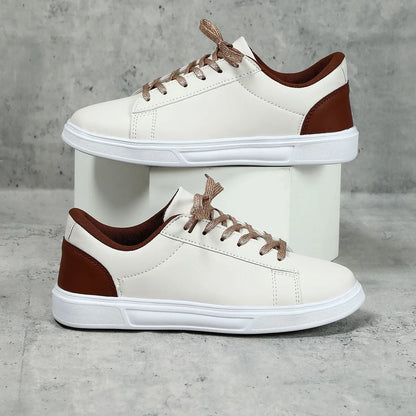 Casual beige brown platform skateboard sneakers with a low-top PU upper, round toe, and cross-strap detail