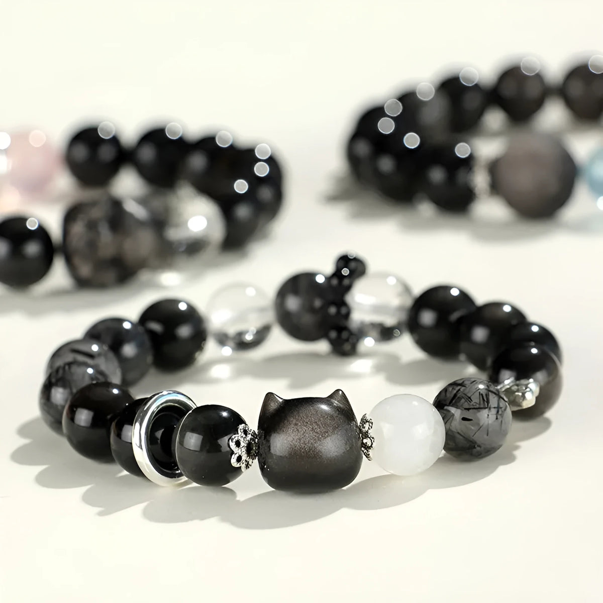 Silver stone crystal beaded bracelet with white, pink and navy blue diamond-cut crystals
