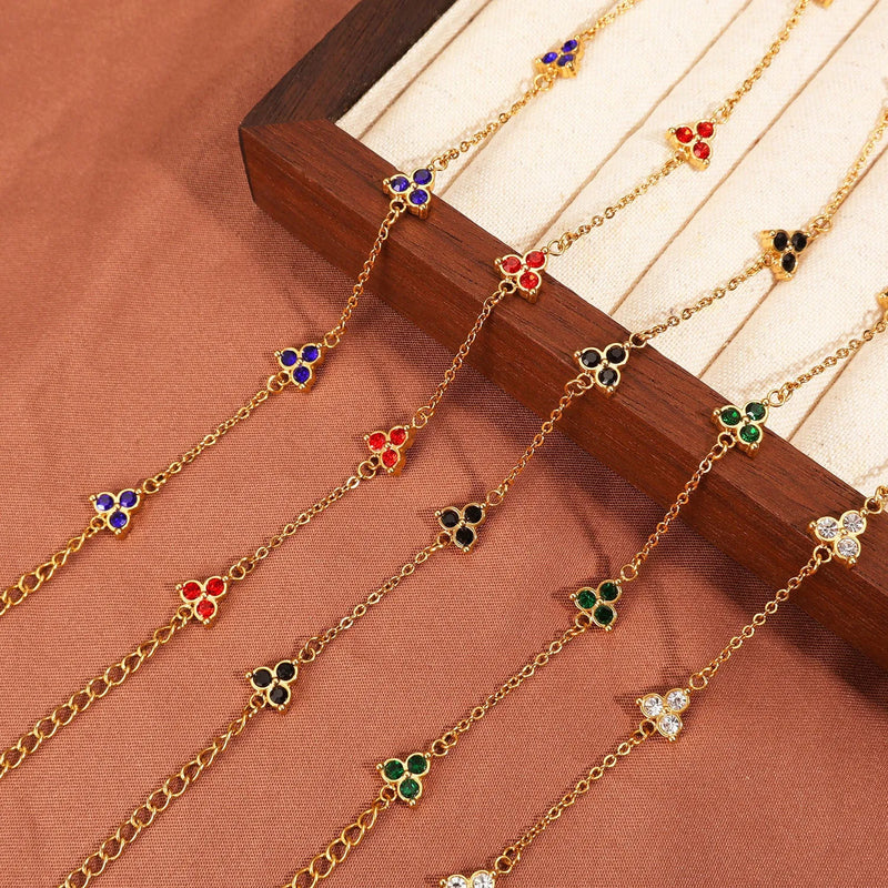 Stainless steel three diamond bracelet for women with gold or steel finishes in five gemstone colour options including white zircon, black zircon, jacinth, blue zircon and Beka stone, a geometric triangular design jewellery accessory