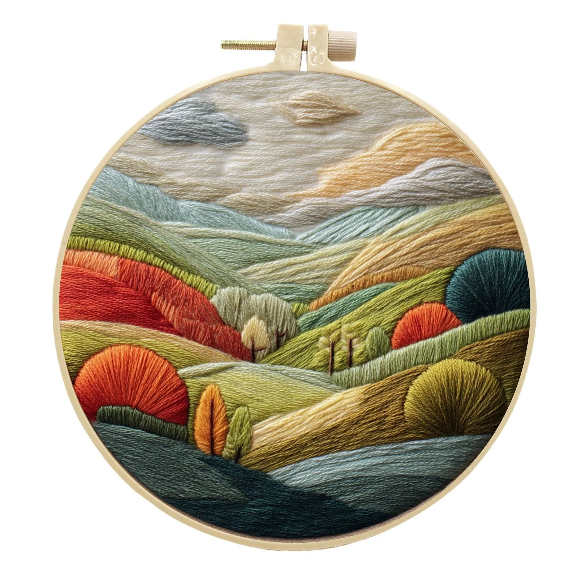 Complete DIY embroidery kit with 15cm bamboo frame, pre-printed landscape fabric, threads, and needles laid out.