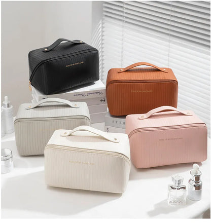 Beige cubic makeup bag with vertical pattern measuring 22.5 by 12.5 by 12.5 centimetres