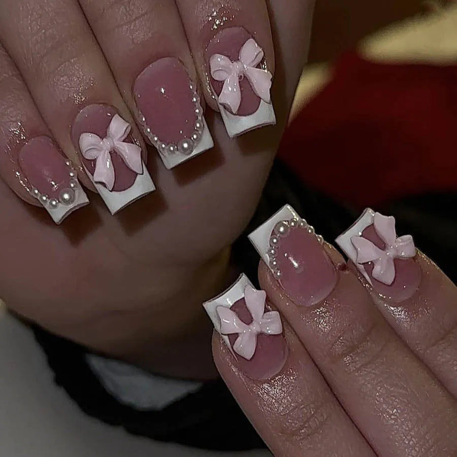 Fashion short white French cute bow manicure set with 24 nail art pieces including tulip, bow, starry sky, leopard print, and XINGX designs.
