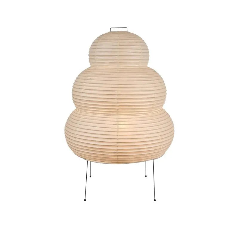 Japanese style table lamp with a white handmade rice paper shade on a slim aluminium base.