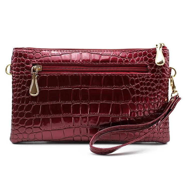 Women's shoulder messenger bag, soft PU leather construction, casual clutch style, black purplish red colour options, horizontal square shape with lining, dimensions 24cm width 14cm height 2cm thickness