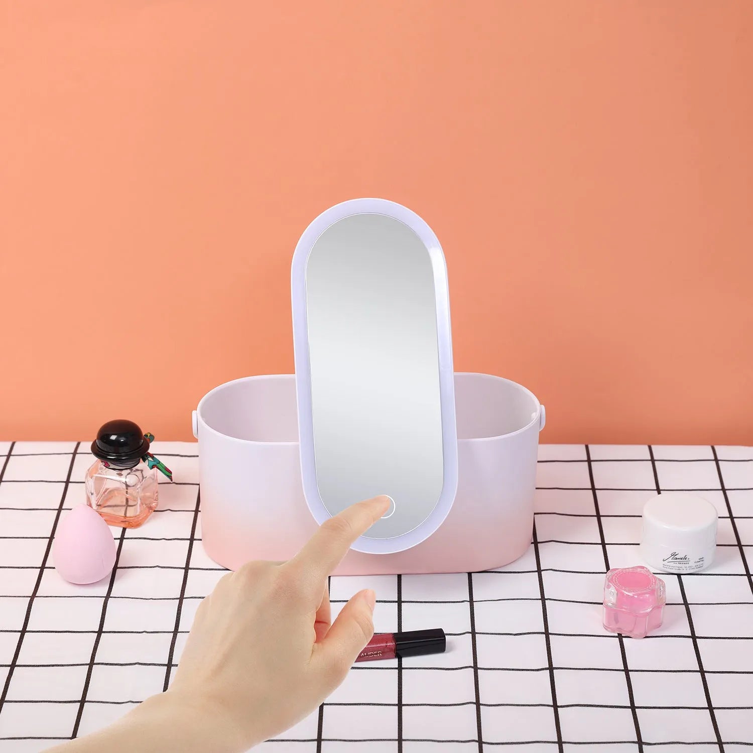 Pink gradient makeup storage box with LED mirror open, showing internal compartments and USB charging port.