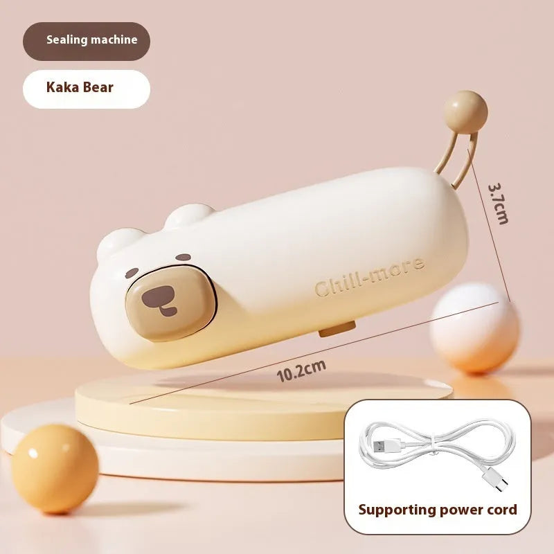 Pink handheld bag sealer machine with USB charging port and cartoon design