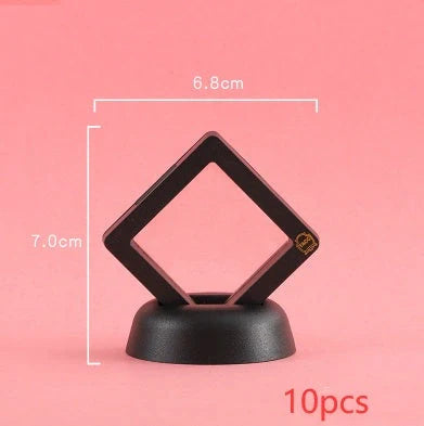 3D floating jewelry coin display stand in white and black, showcasing collectibles in mid-air