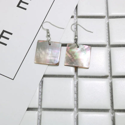 Women's geometric shell earrings in square panther or rectangular shell designs with natural retro style
