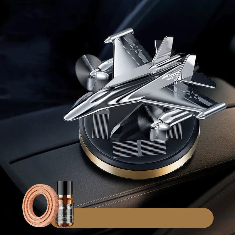 Solar-powered rotating perfume ornament in fighter jet design with aluminium alloy seat and essential oil bottle