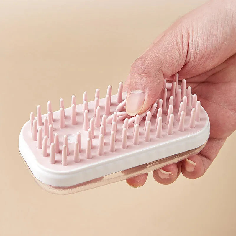 Grey and pink silicone pet bath brush with soft bristles for dogs and cats.