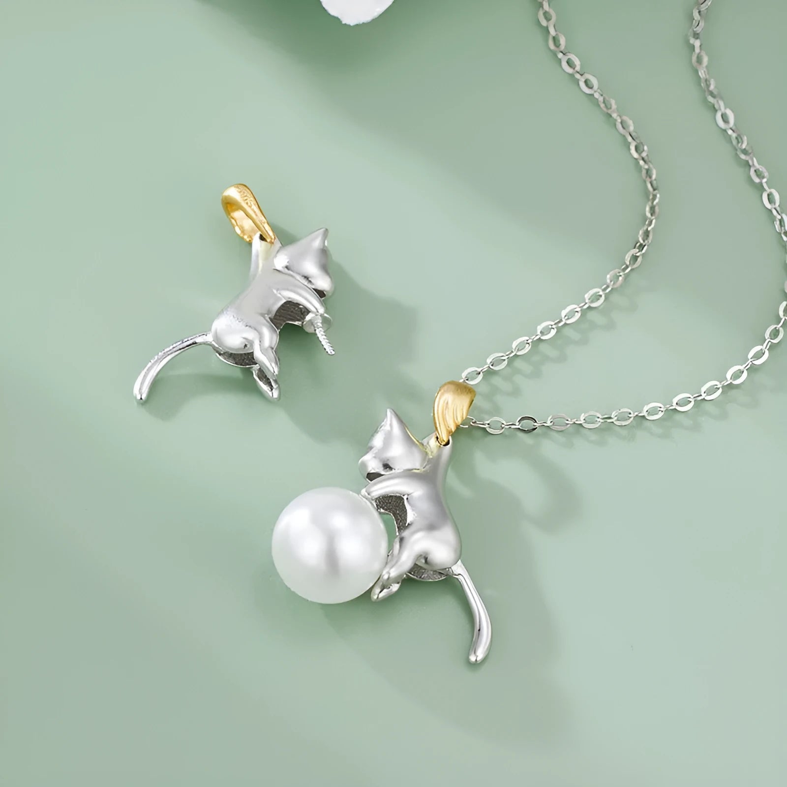 Close-up of a delicate 925 sterling silver cat charm on a 45cm clavicle chain with a lobster clasp.