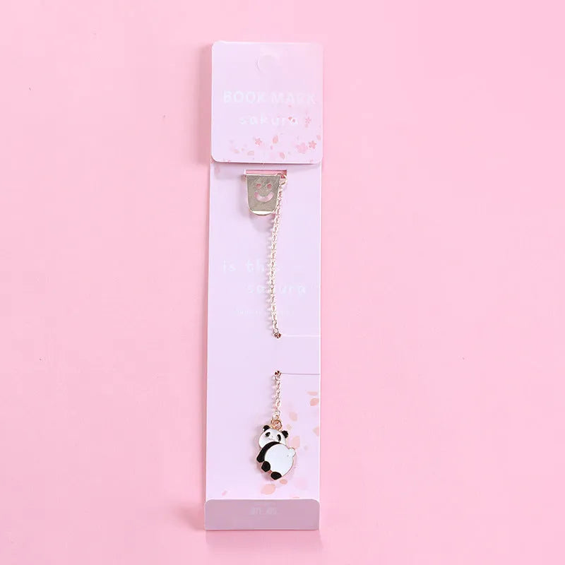 Alloy metal cartoon pendant bookmark with colourful charms including panda, rocket, and wishing bottle designs