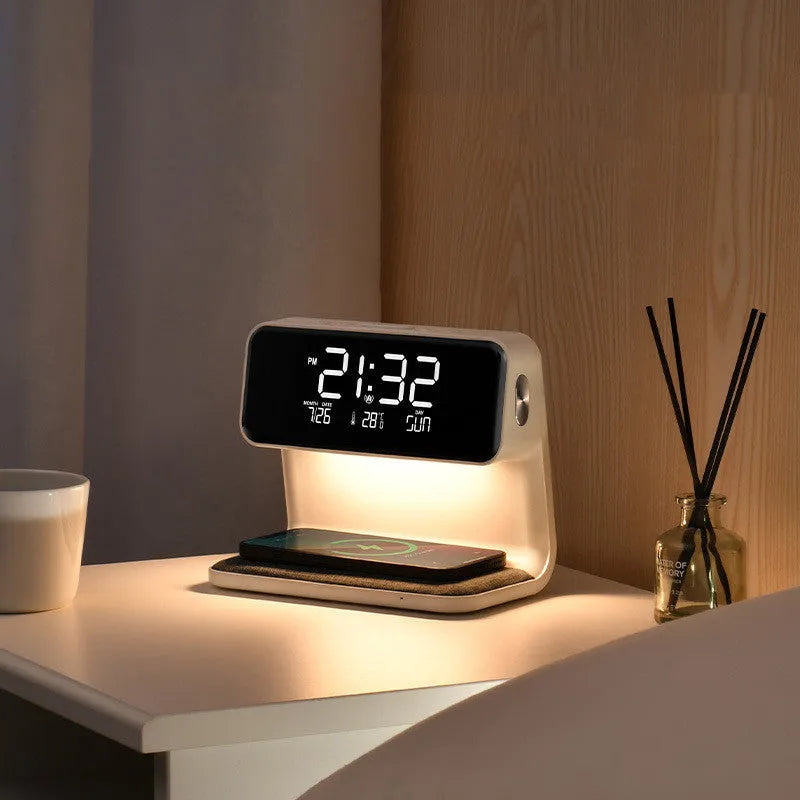 White 3-in-1 bedside lamp with wireless charging pad, LCD alarm clock screen, and touch controls.