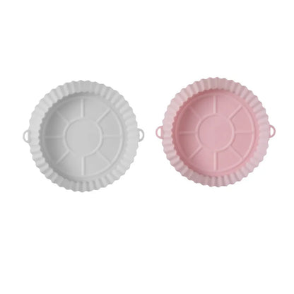 Round blue silicone baking tray mat with 4.5cm sides on a kitchen counter.