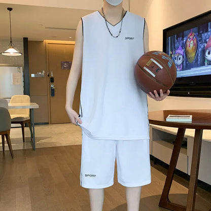 Man wearing a grey sleeveless basketball vest and matching shorts for sports.