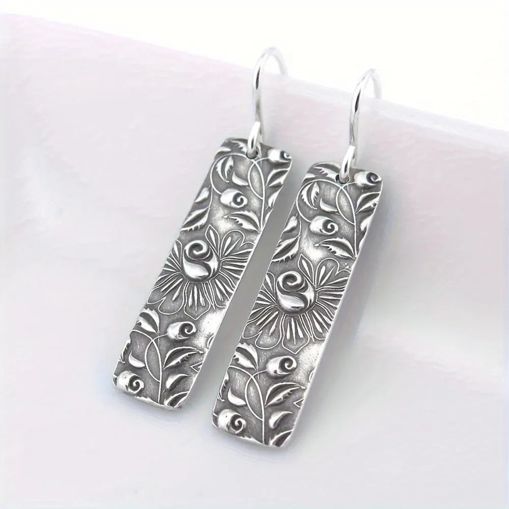 Geometric long earrings with carved vine pattern in silver zinc alloy