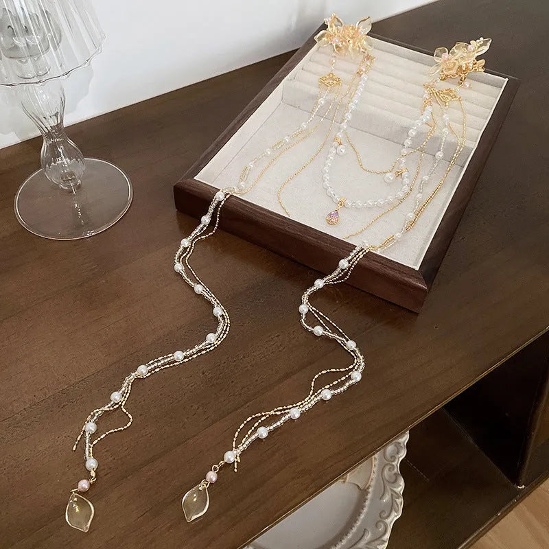 Gold acrylic women's hairpin with long tassel and pearl diamond accents