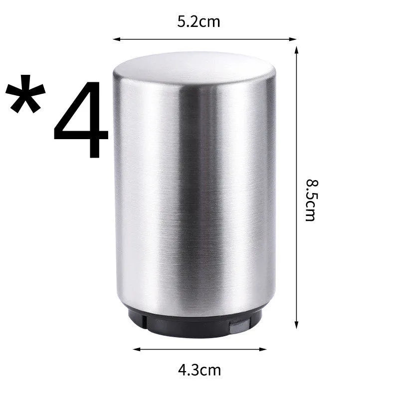 Stainless steel automatic bottle opener measuring 8.4 cm by 5.3 cm on a kitchen counter
