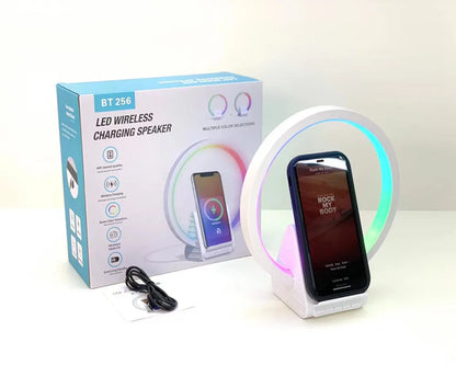 White smart Bluetooth speaker with ambience light and wireless charging pad