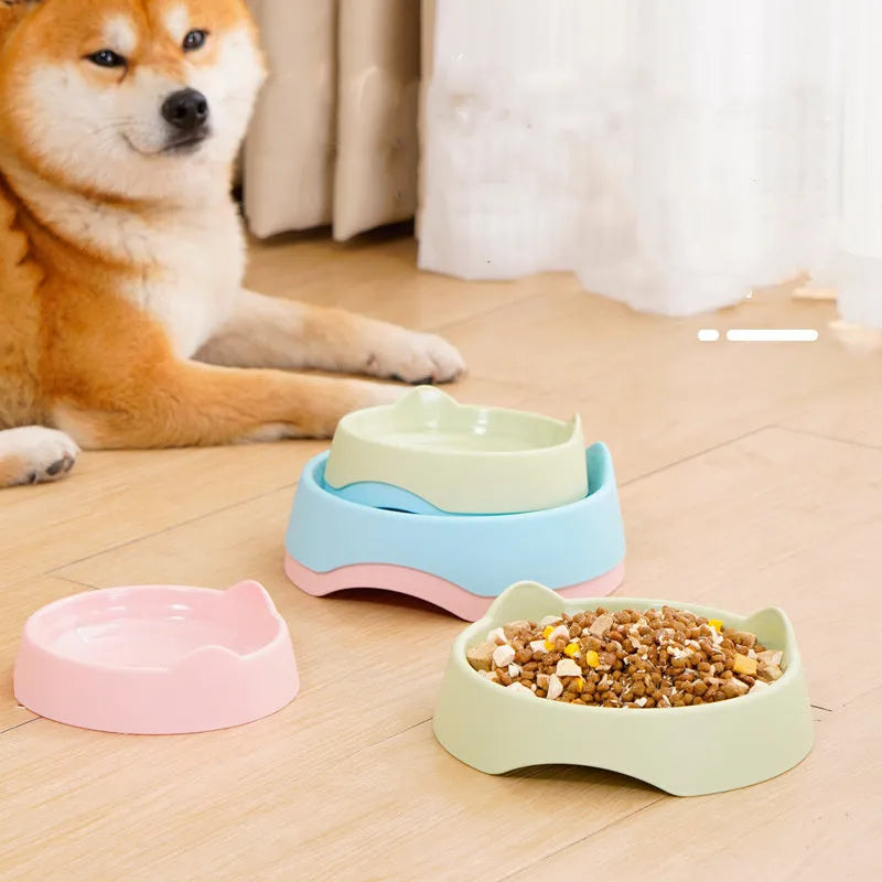 Blue ceramic dog slow feeder bowl with raised internal maze pattern for large breed dogs on a wooden floor.