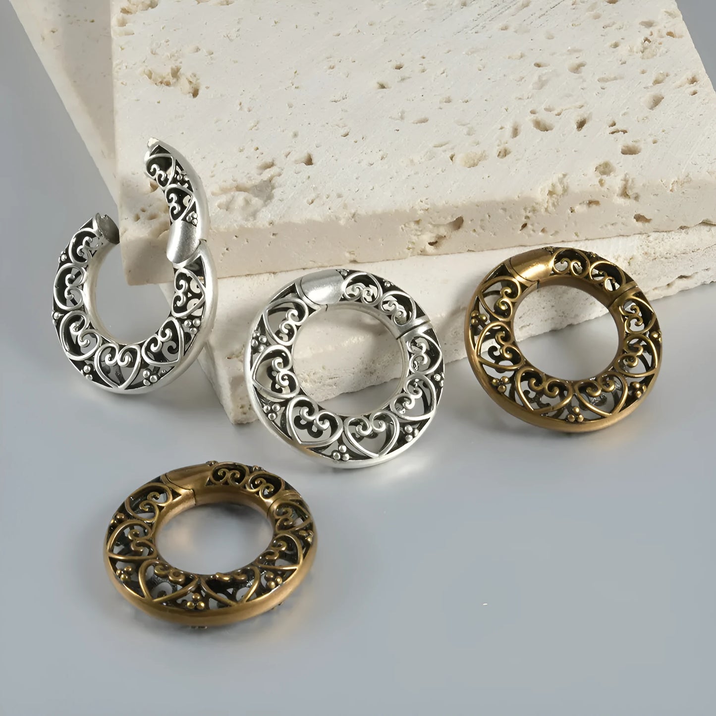 Stainless steel magnetic earrings with hollow heart or lotus design in antique silver or gold finish