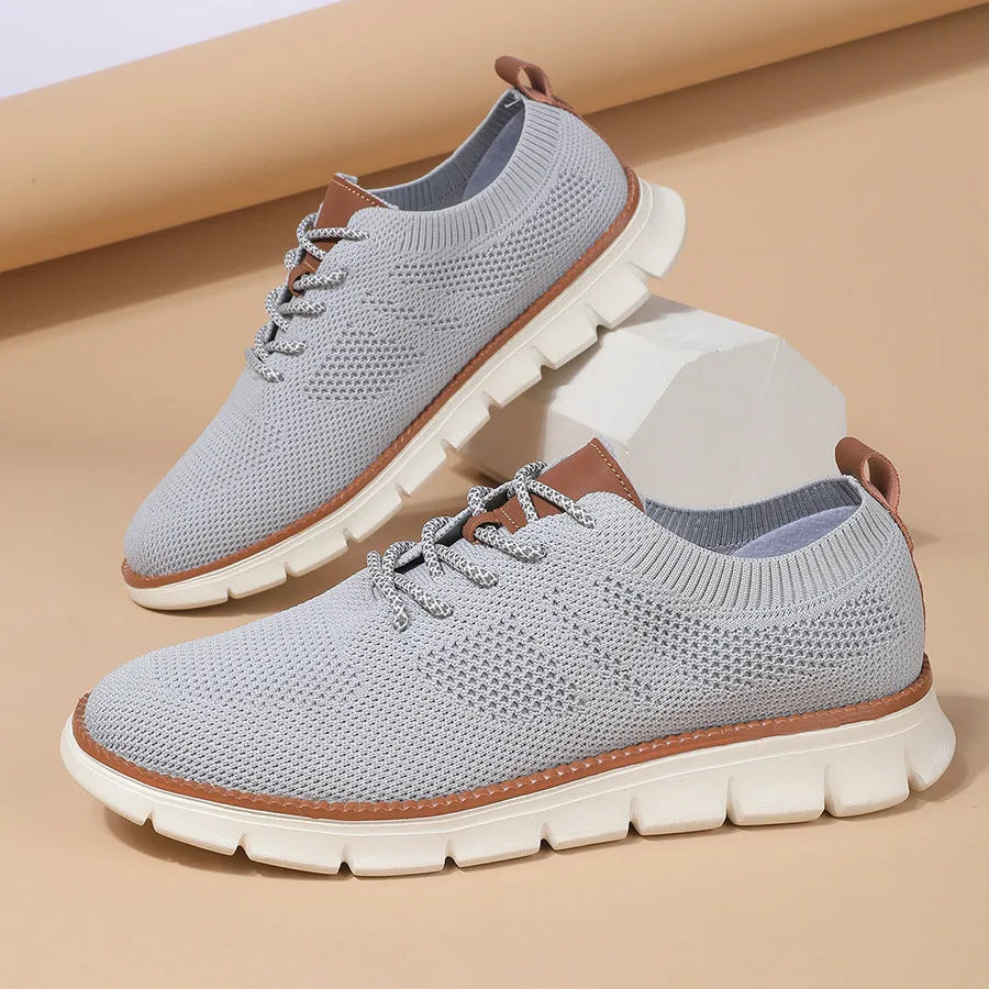 Men's grey and black low-heel casual sneaker with mesh fabric upper and round toe