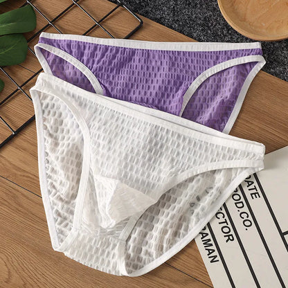 Men's low waist transparent lace underwear in various colours on a size chart background.