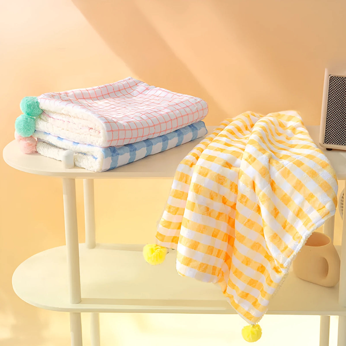 A blue coral fleece pet blanket laid flat, showing its soft texture and rectangular shape as a dog or cat bed mat.