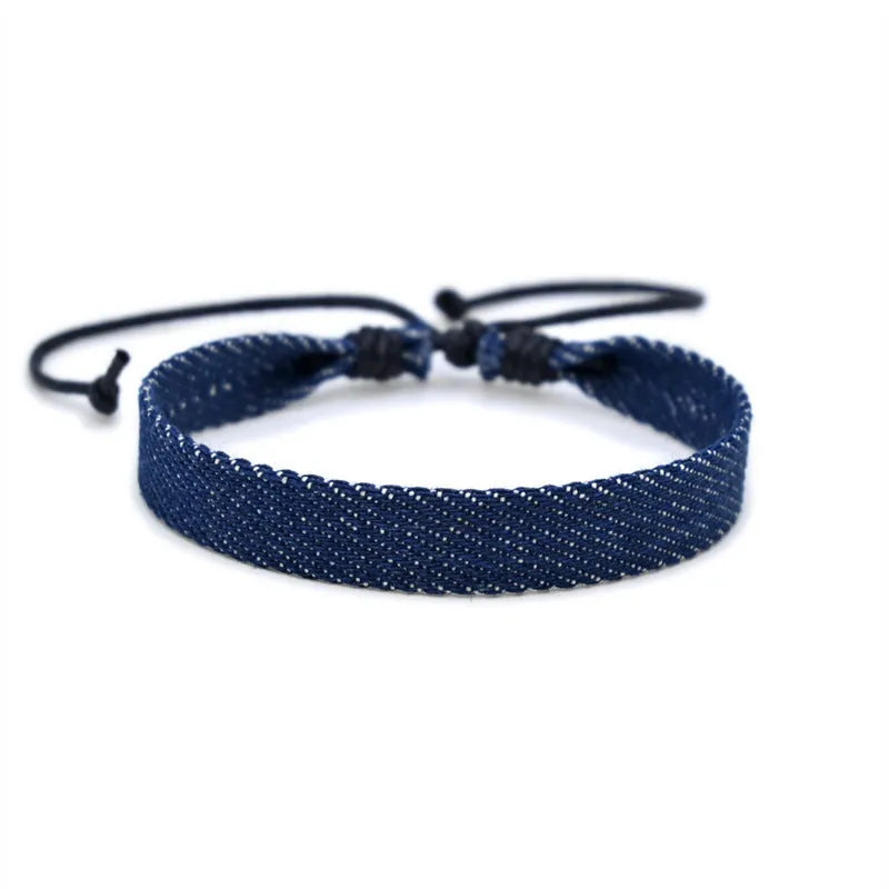 National style denim fabric bracelet carrying strap showing mixed material construction and wristband design