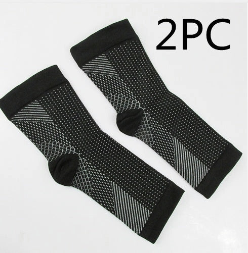 Anti-fatigue compression foot sleeve in black, red, or white, featuring moisture-wicking fabric and a heel hole for breathability.