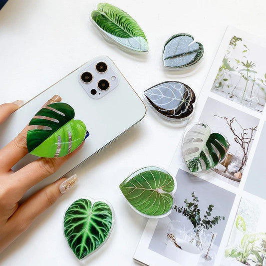 Stylish smartphone stand with leaf-inspired design for secure hands-free support and mobile device versatility