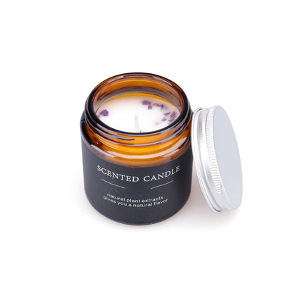 Brown glass bottle containing a hand-poured scented candle with a choice of sunny rose, lavender thyme, or bayberry fragrance.